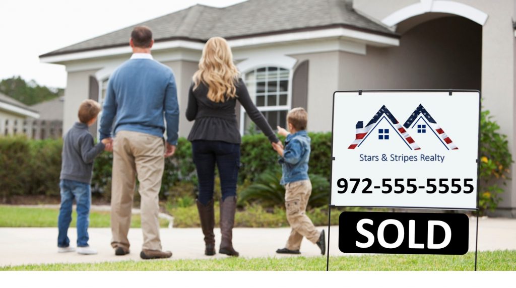 family standing in front of home with sold sign