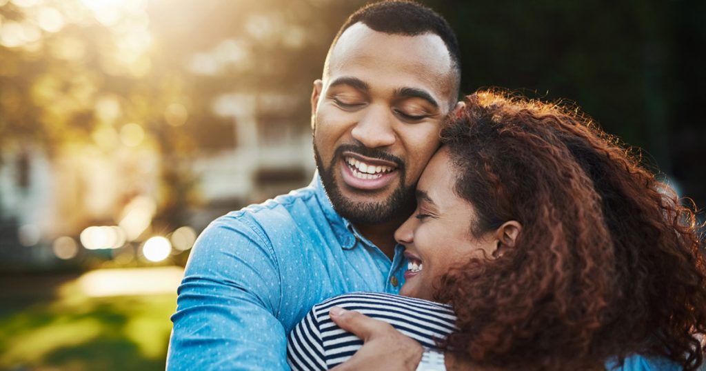 Shot of a happy young couple embracing in the park